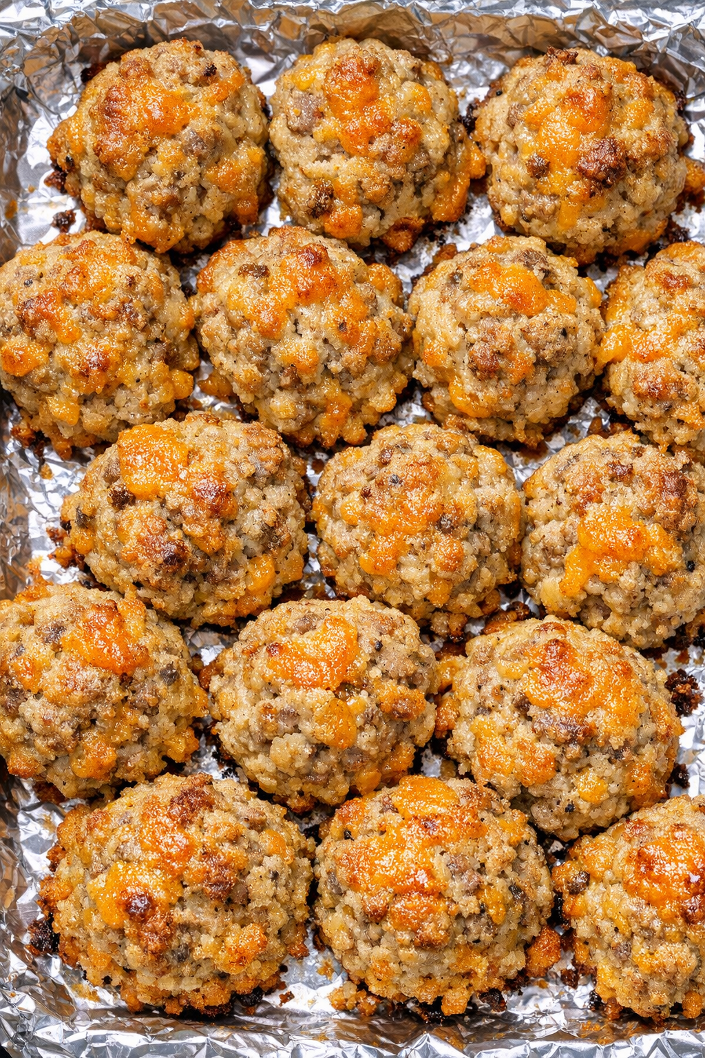 Southern 3-ingredient sausage cheese balls on a foil-lined baking tray