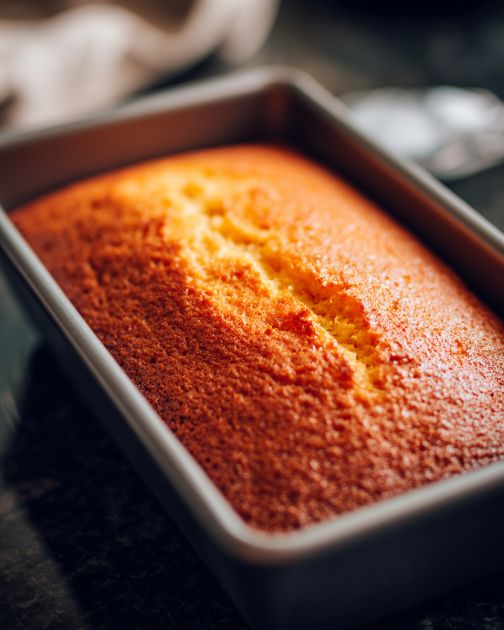 There's something timeless about a classic vanilla pound cake. This recipe has been a staple in my family for generations, often making an appearance at Sunday brunches or as a sweet treat after dinner. The origins of the pound cake date back to the 18th century, where it was named for its simple formula: a pound each of flour, butter, sugar, and eggs. It's a go-to for anyone looking to create a dessert that is both elegant and comforting. The subtle yet rich vanilla flavor makes it perfect for any occasion. Whether you're hosting a gathering or just want to enjoy a slice with your afternoon coffee, this vanilla pound cake is sure to impress. A classic vanilla pound cake is incredibly versatile when it comes to serving options. For a simple yet delightful pairing, consider serving it with a dollop of freshly whipped cream and a handful of berries for a pop of color and tartness. If you're in the mood for something more indulgent, try a scoop of vanilla ice cream on the side. This cake also pairs beautifully with a hot cup of tea or coffee, making it an ideal choice for an afternoon treat or a casual get-together with friends. Advertisement Classic Vanilla Pound Cake Servings: 8 Ingredients 1 cup (2 sticks) unsalted butter, softened 1 cup granulated sugar 4 large eggs 1 teaspoon vanilla extract 2 cups all-purpose flour 1/2 teaspoon baking powder 1/4 teaspoon salt 1/4 cup milk Directions Preheat your oven to 350°F (175°C). Grease and flour a 9x5 inch loaf pan. In a large mixing bowl, cream together the softened butter and sugar until light and fluffy. Add the eggs, one at a time, beating well after each addition. Stir in the vanilla extract. In another bowl, sift together the flour, baking powder, and salt. Gradually add the dry ingredients to the creamed mixture, alternating with the milk, beginning and ending with the flour mixture. Mix until just combined. Pour the batter into the prepared loaf pan, smoothing the top with a spatula. Bake in the preheated oven for about 60-70 minutes, or until a toothpick inserted into the center comes out clean. Allow the cake to cool in the pan for about 10 minutes, then transfer it to a wire rack to cool completely. Advertisement Variations & Tips For a citrus twist, add the zest of one lemon or orange to the batter. You can also experiment with different extracts like almond or coconut for a unique flavor. If you prefer a more moist cake, try replacing the milk with sour cream or yogurt. To make it extra special, consider drizzling a simple glaze made of powdered sugar and lemon juice over the top once the cake has cooled. 2 c1a91fb35e0f6cf9e58721176a556a90