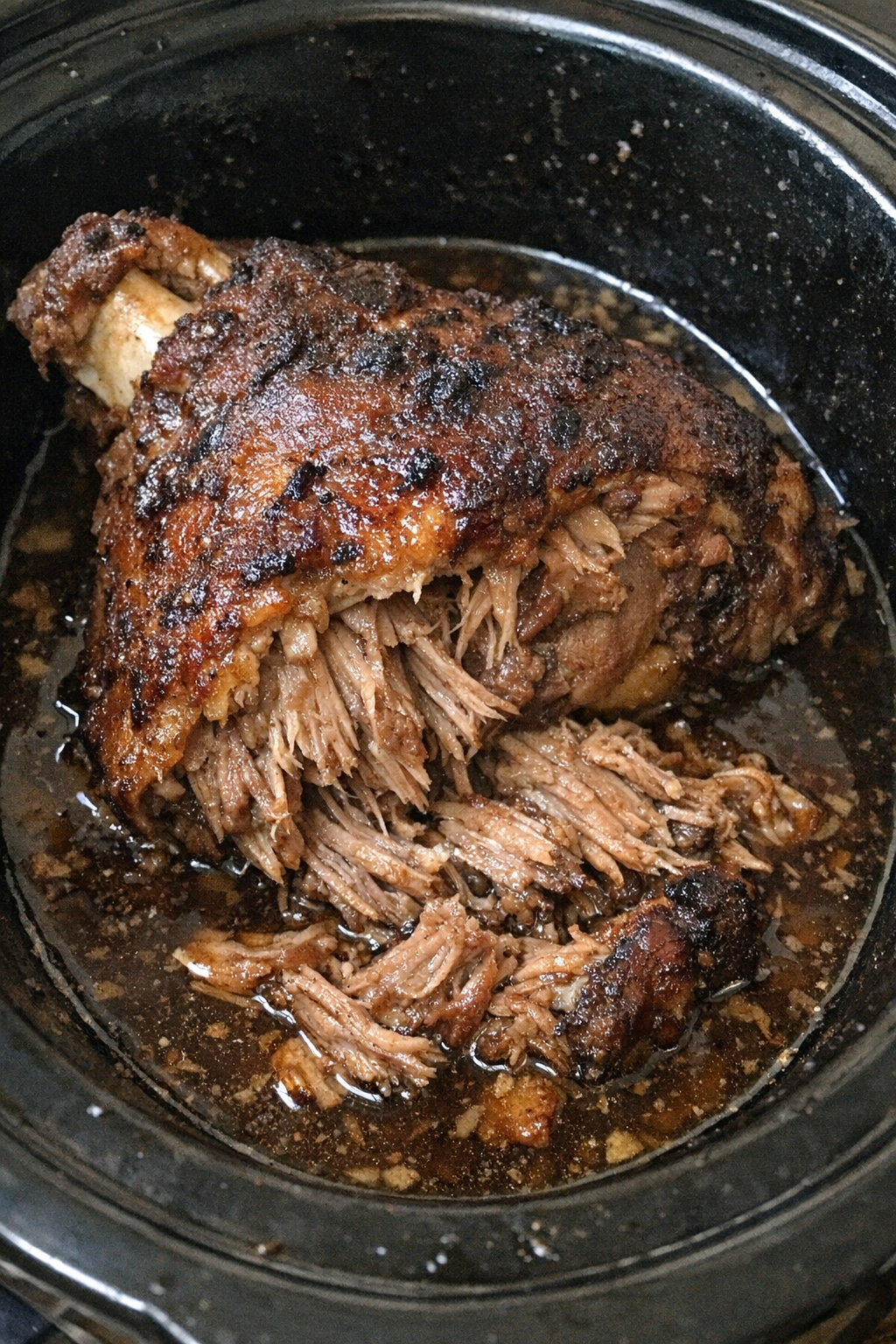 Slow cooker pork leg roast in savory broth