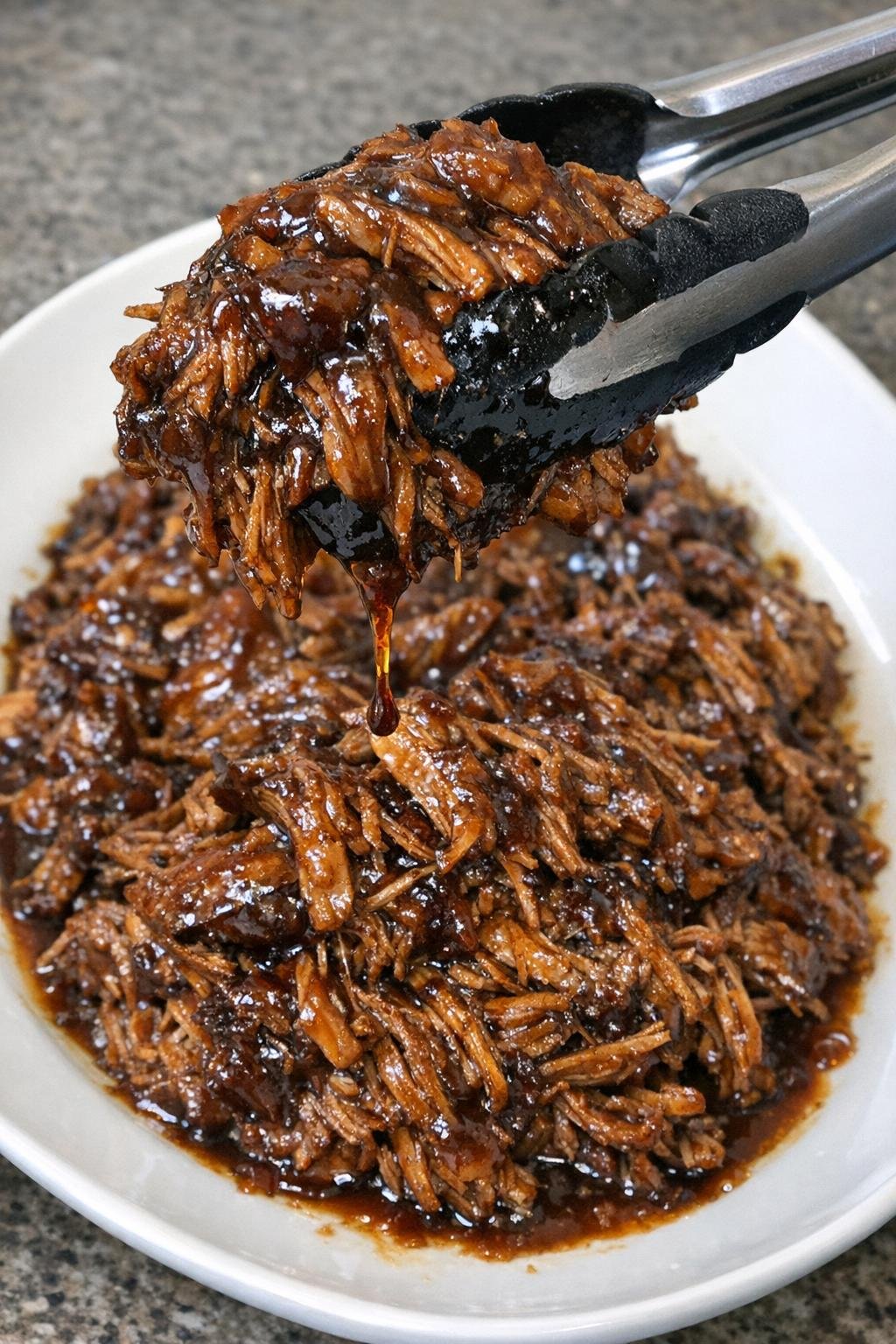 Finished root beer pulled pork with glossy sauce