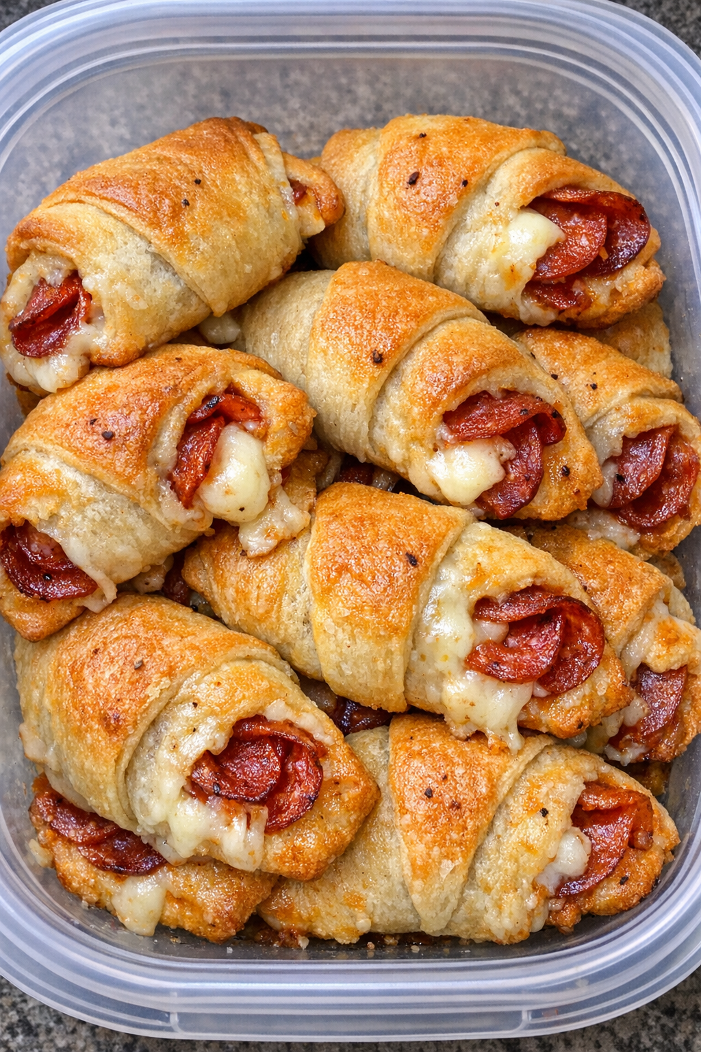 3-ingredient crescent pizza rolls in a clear container