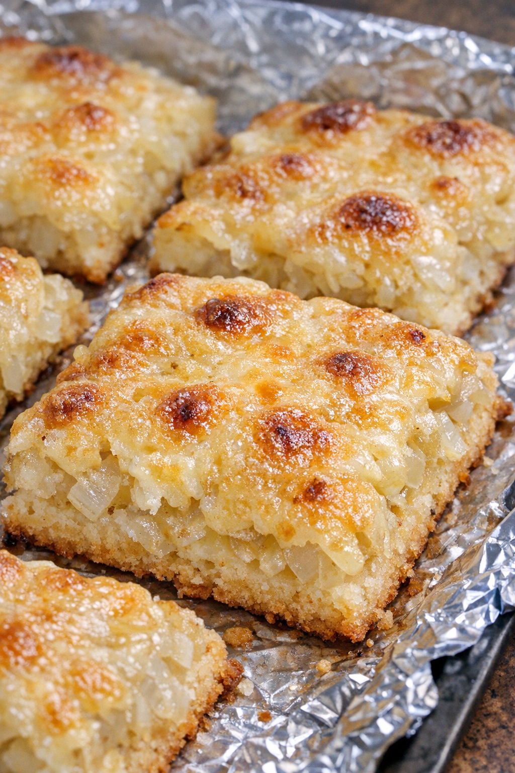 Southern 4-ingredient sweet onion squares on a foil-lined baking tray
