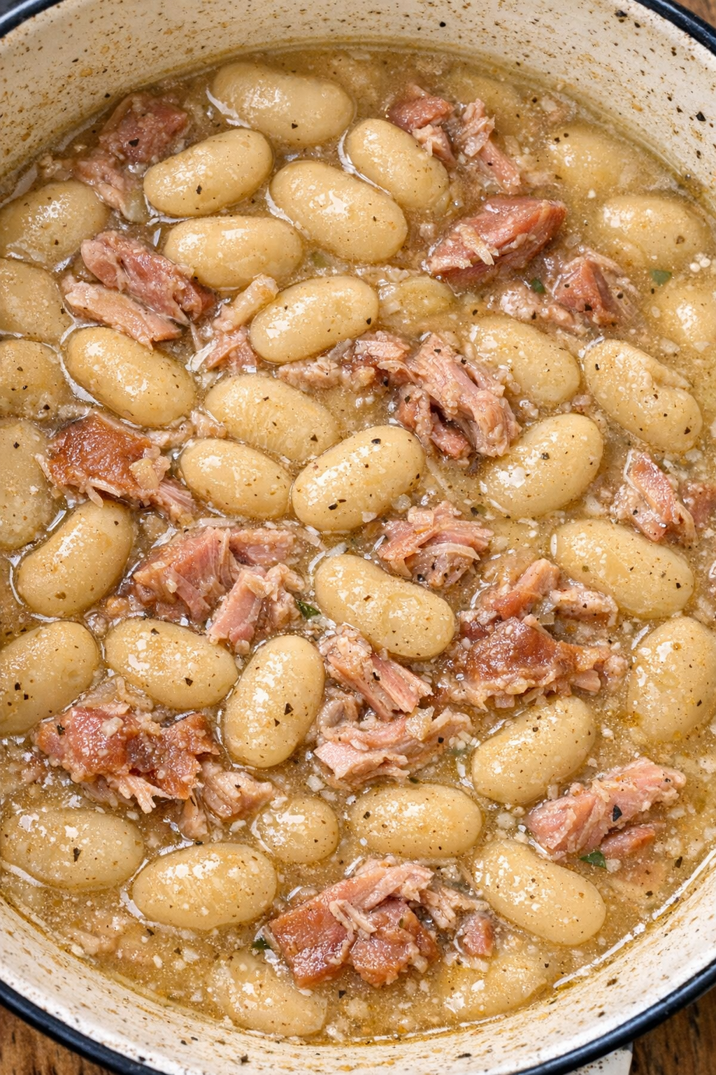 3-ingredient butter beans and ham hock in an enamel roasting pan