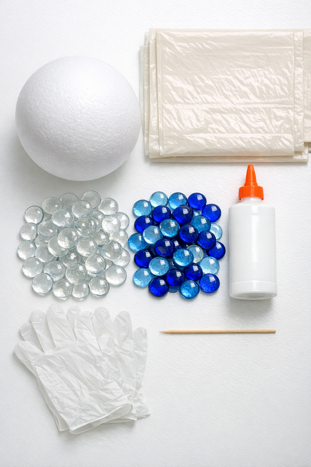 Materials for a DIY gazing ball laid out on a table