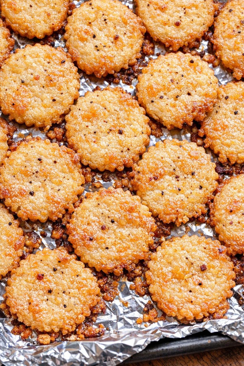 Southern 3-ingredient flaky cheddar pennies on a foil-lined baking tray