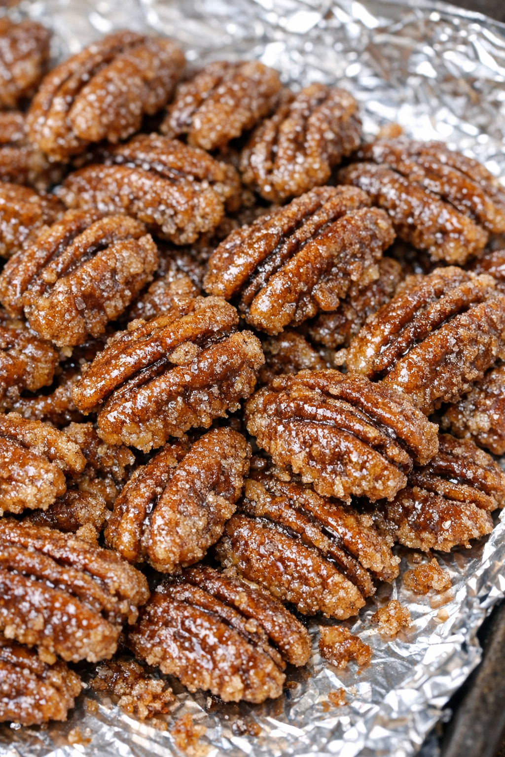 Southern 4-ingredient candied pecans on a foil-lined baking tray
