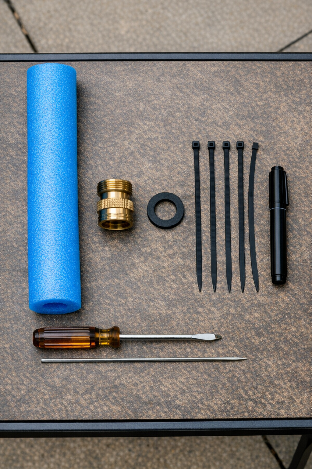 Pool noodle sprinkler materials laid out on a table