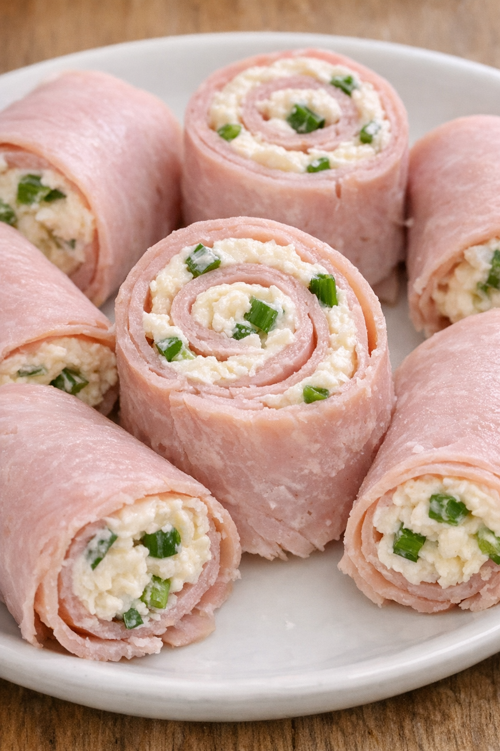 Southern 3-ingredient ham roll ups on a white plate