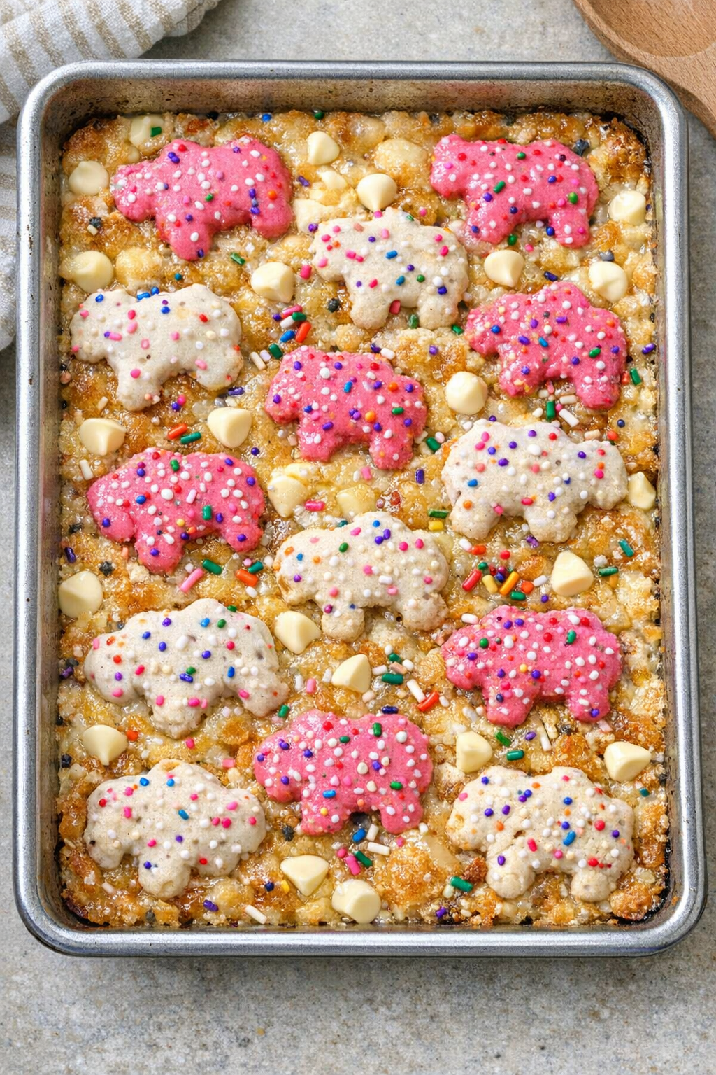 Baked frosted animal cookie dessert in a sheet pan