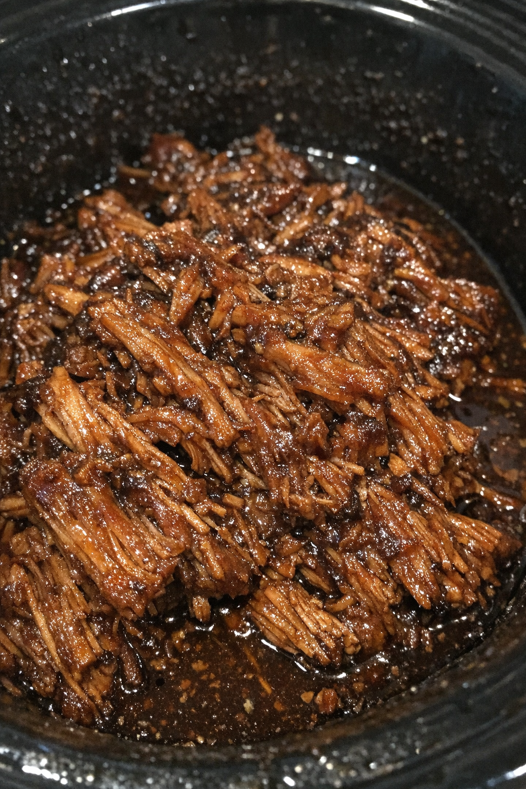 Slow cooker glazed fibrous protein in dark savory sauce
