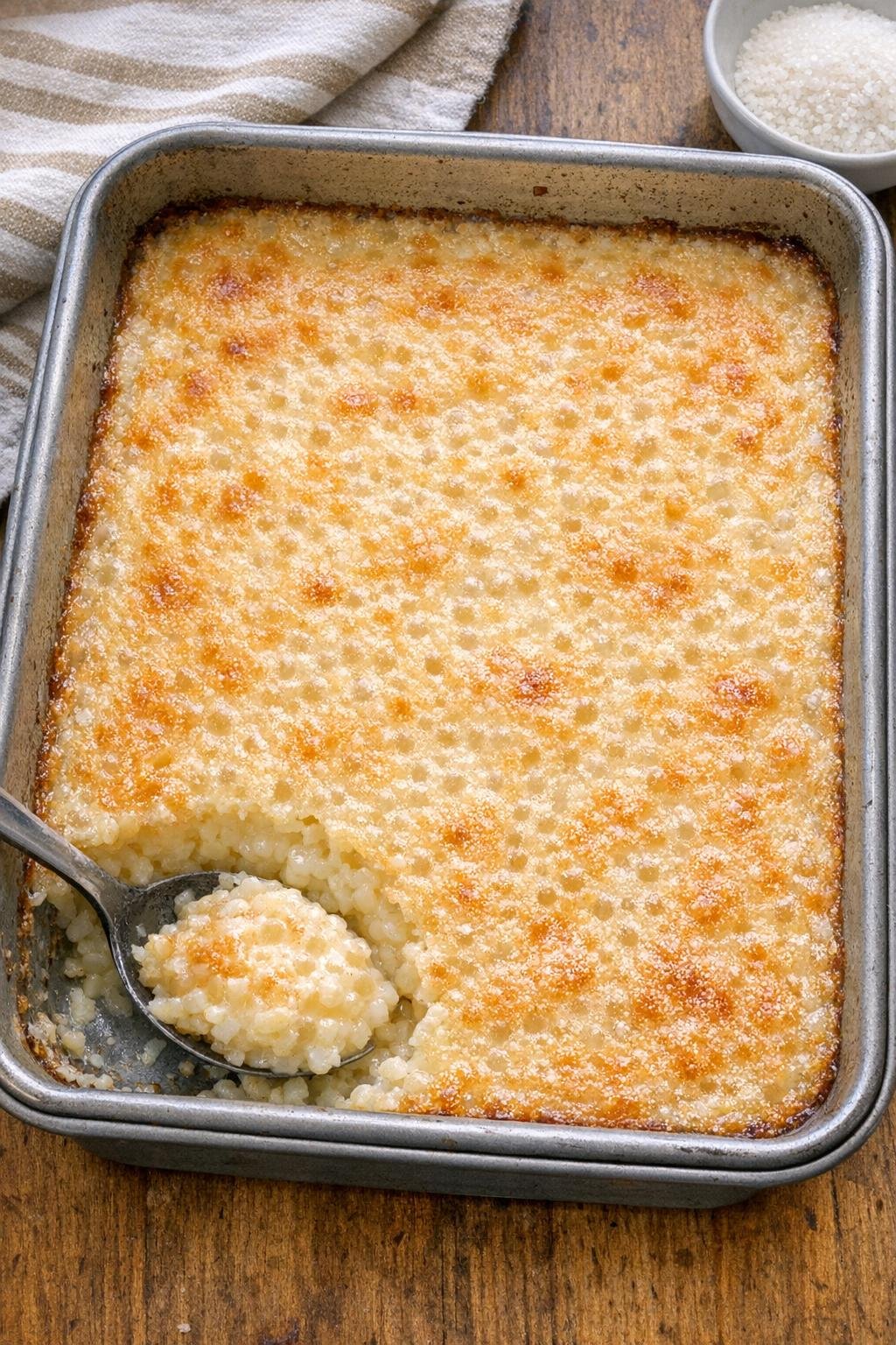 Finished baked pearl tapioca dessert in a metal baking dish