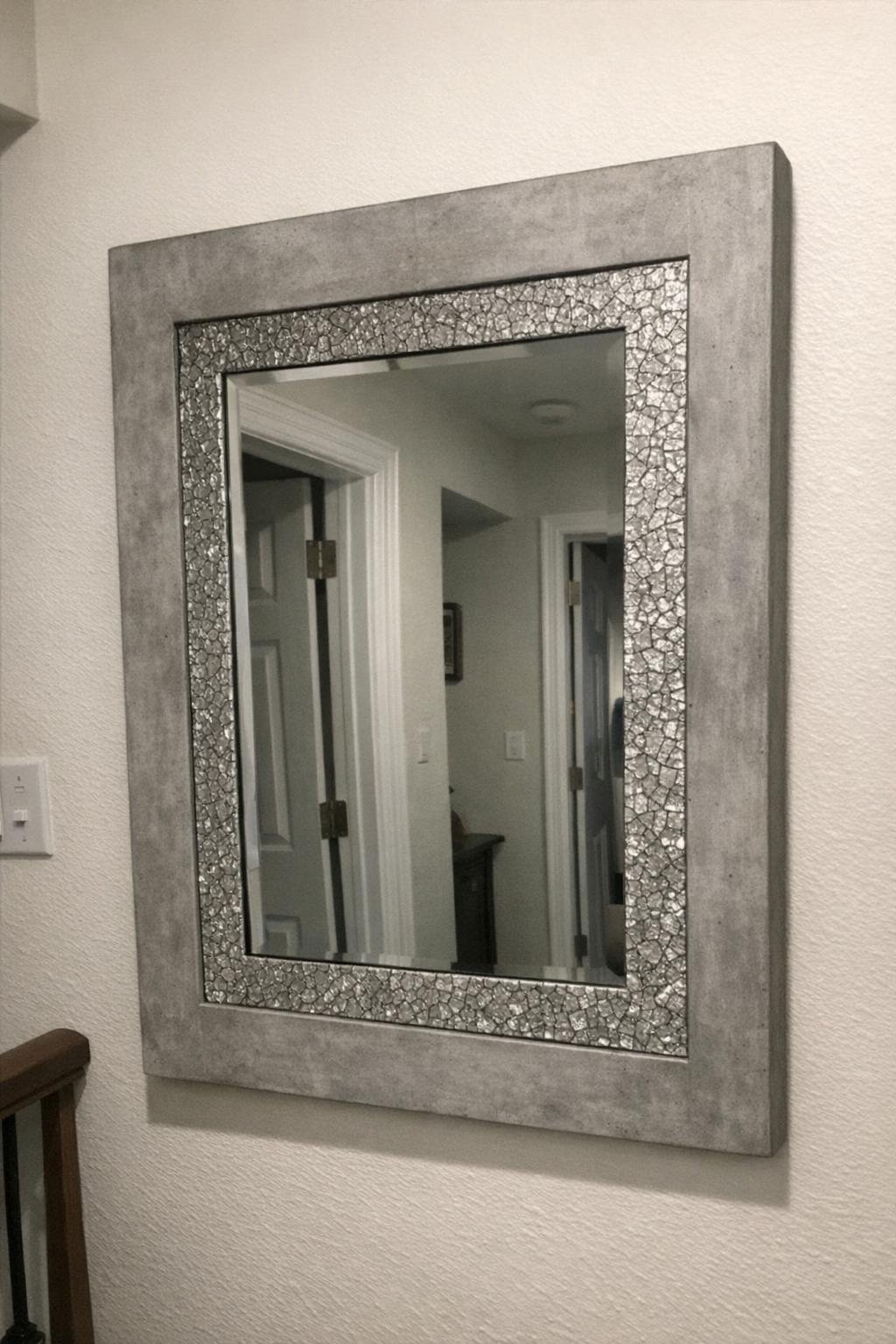 Mirror with a concrete frame and crackled foil texture