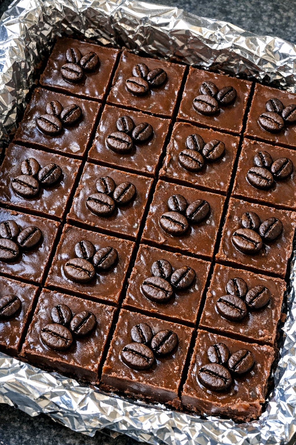 Slow cooker espresso martini fudge squares in a foil-lined pan