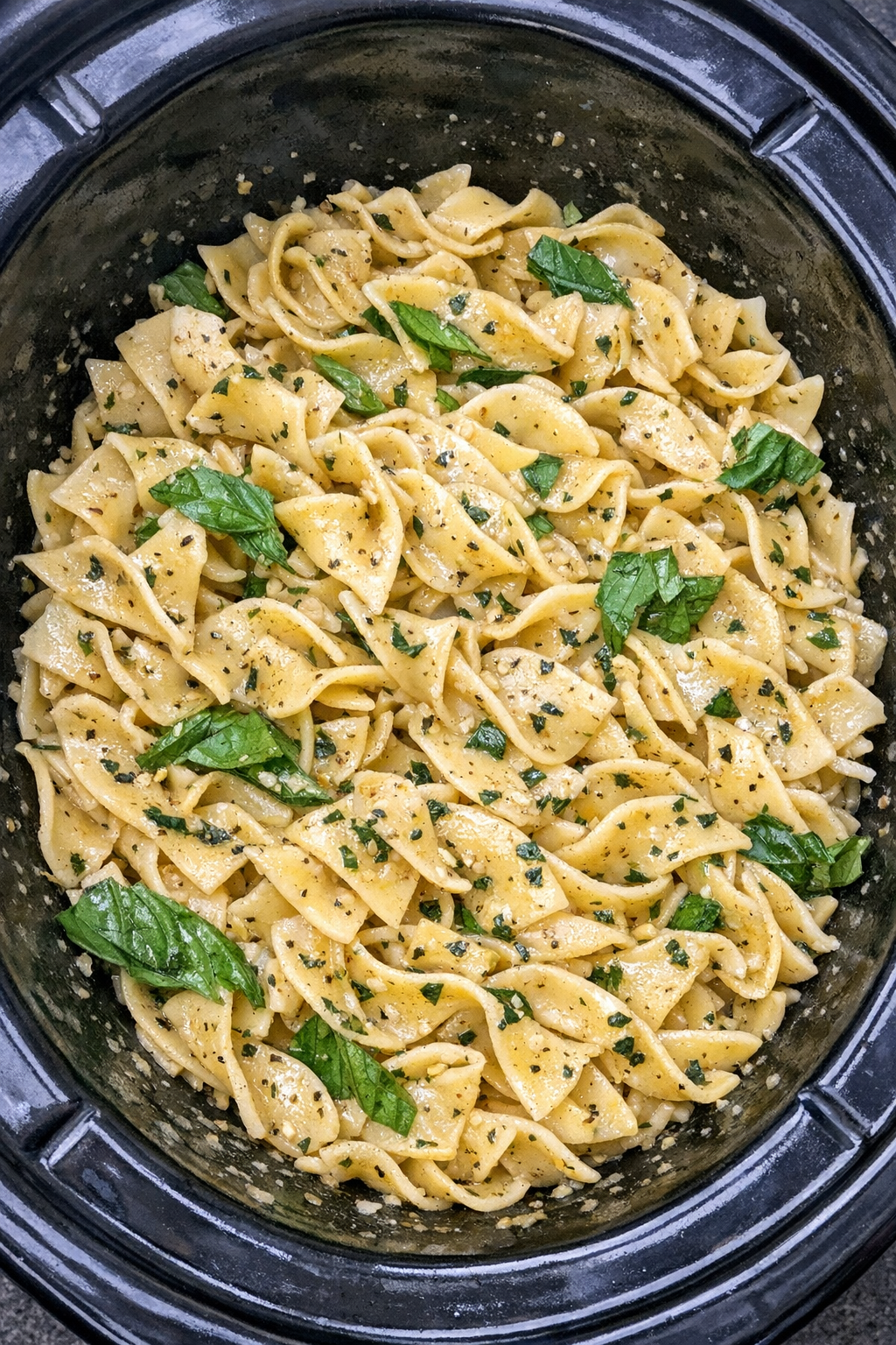 Slow cooker Amish basil noodles in a black slow cooker