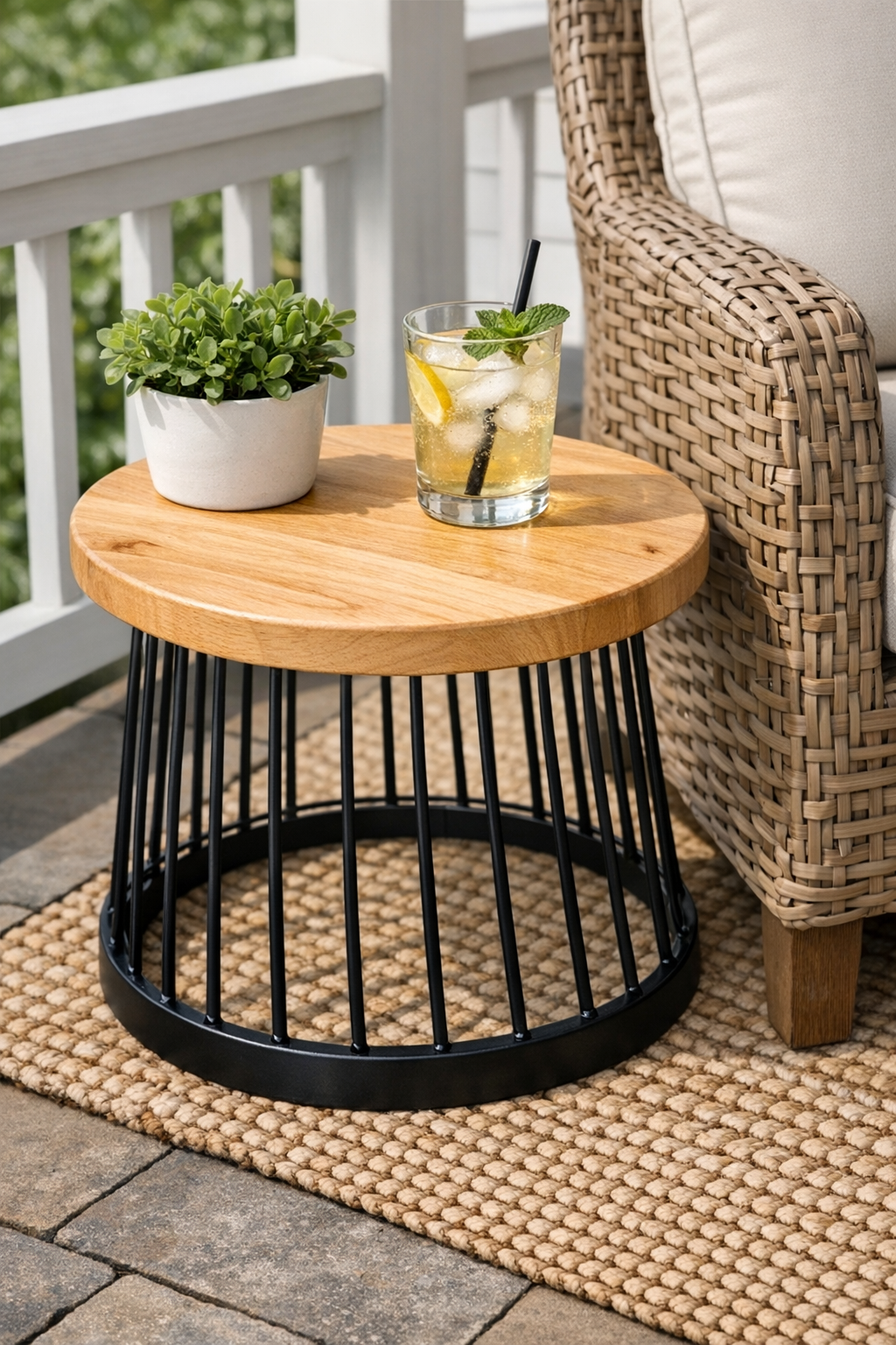 Finished patio side table made from an upside-down wire basket with a round wooden cutting board top