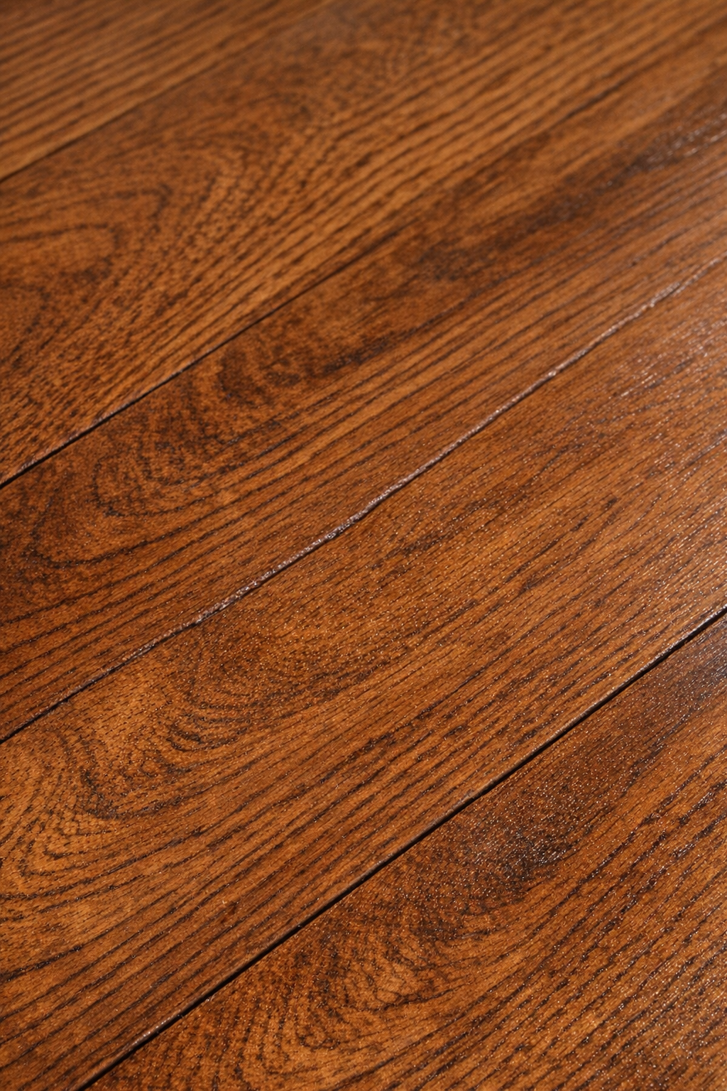 Completed floor crack repair filled with blended crayon wax