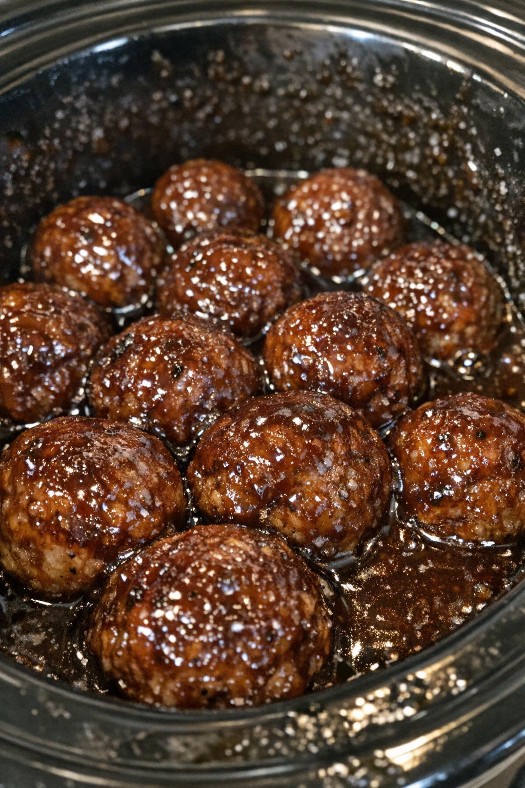 Slow cooker glazed meatballs in dark sauce