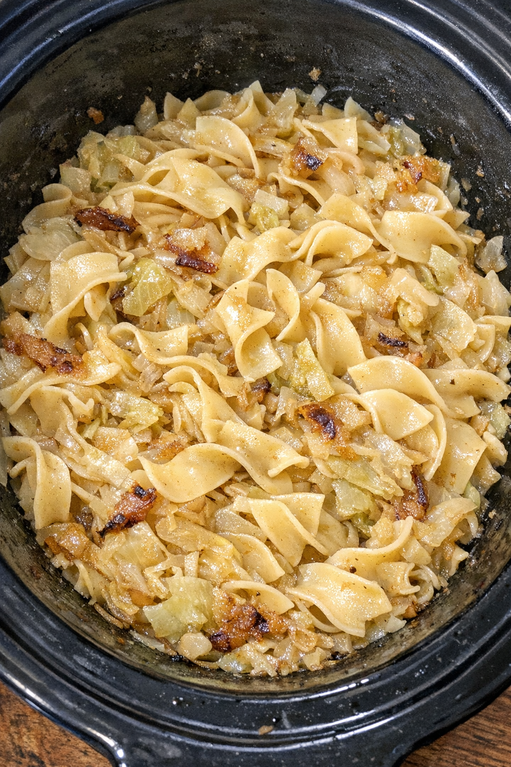 Slow cooker Amish cabbage noodle pot in a black slow cooker