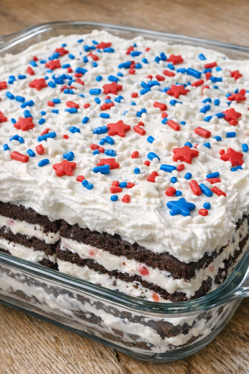 3-ingredient ice cream sandwich cake topped with whipped topping and candy