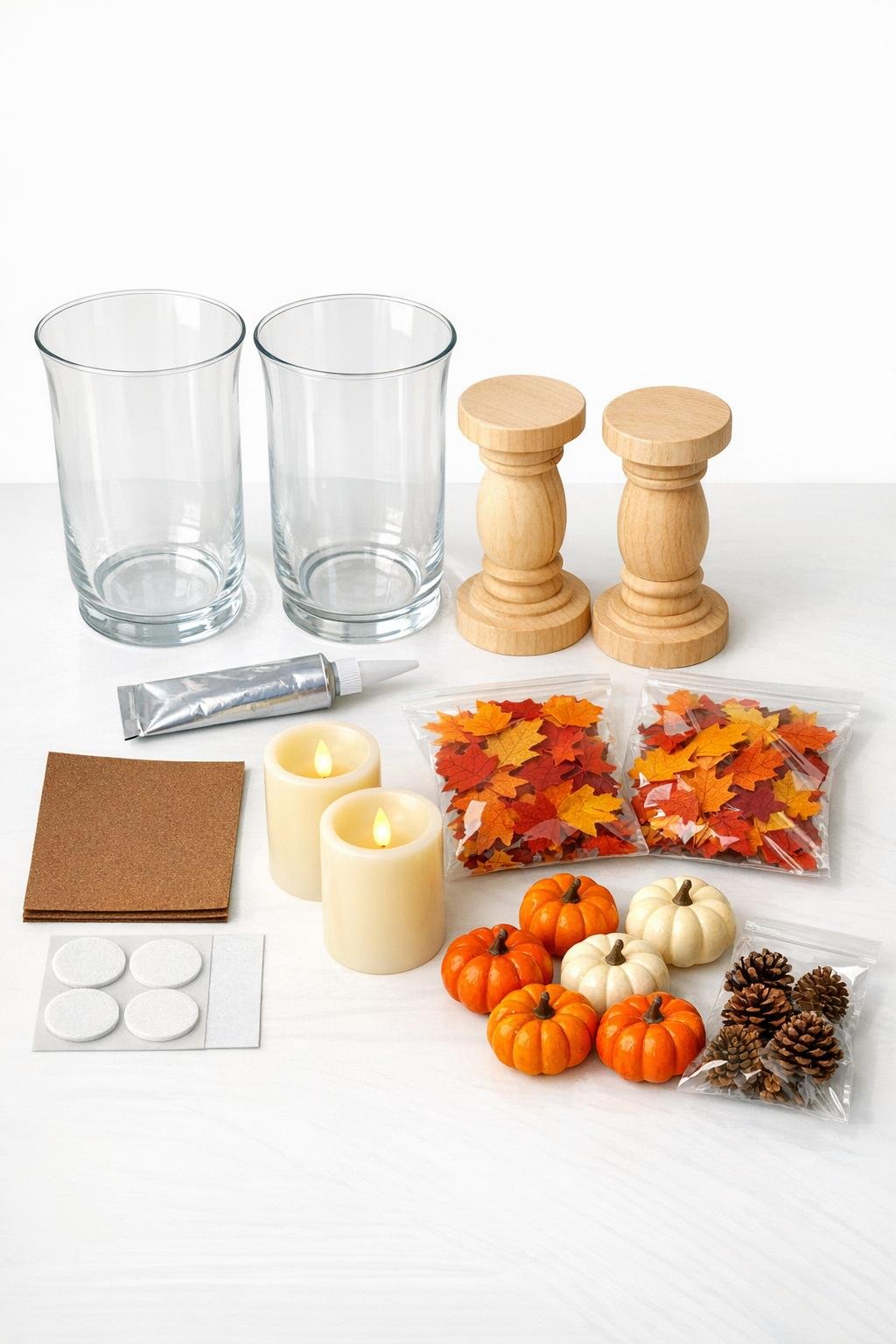 Materials for two autumn lanterns laid out on a table