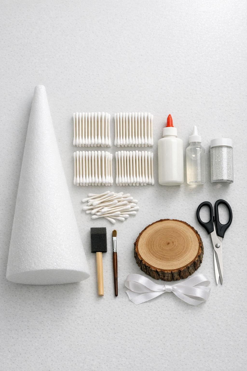 Materials laid out for a cotton swab Christmas tree project