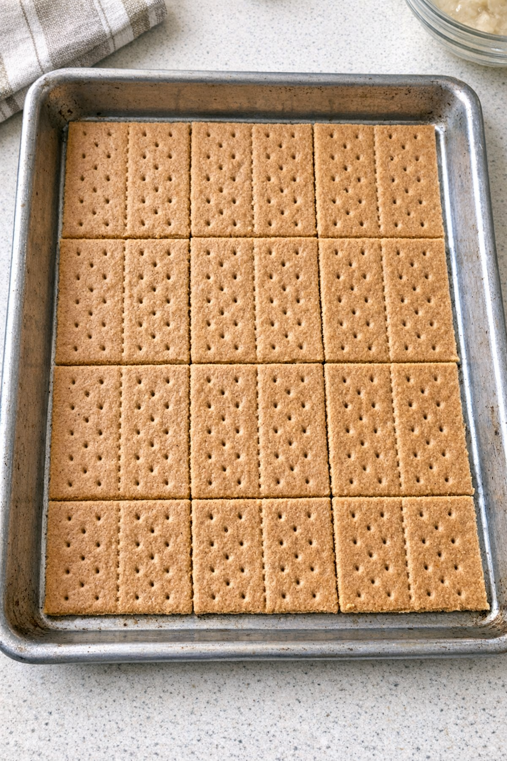 Graham cracker sheets arranged in a sheet pan