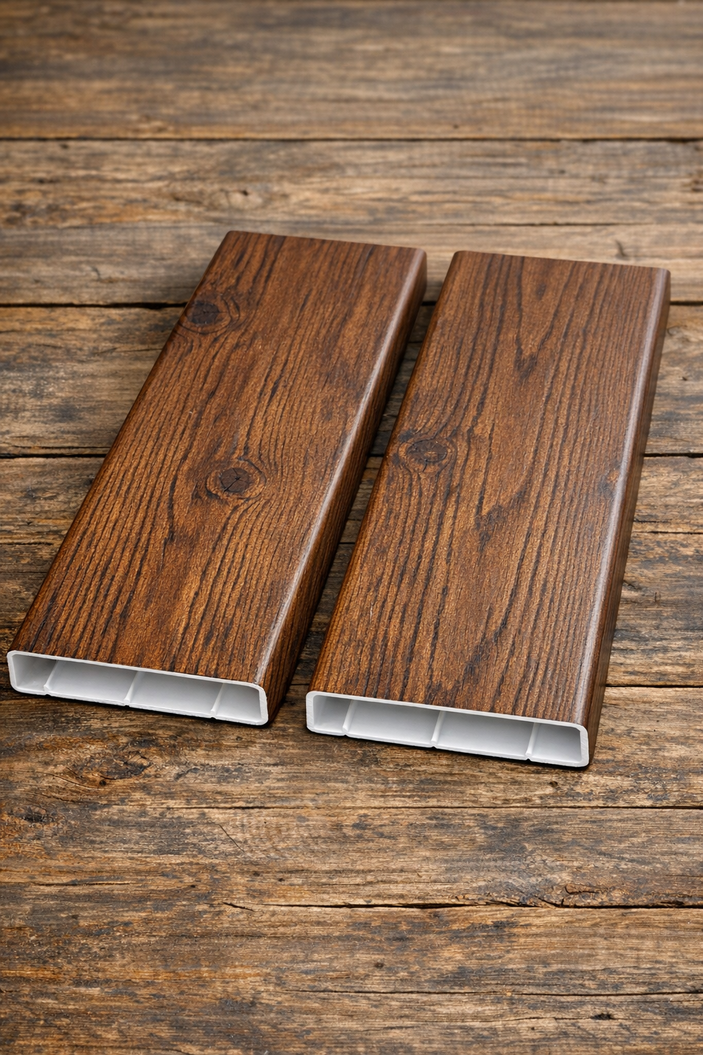 Finished faux wood-style planks made from flattened white PVC pipes
