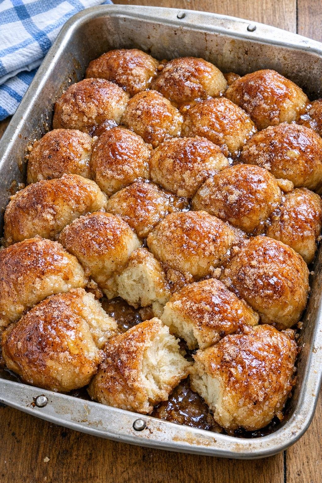 Finished baked cinnamon sugar dough pull-apart dessert in a roasting pan