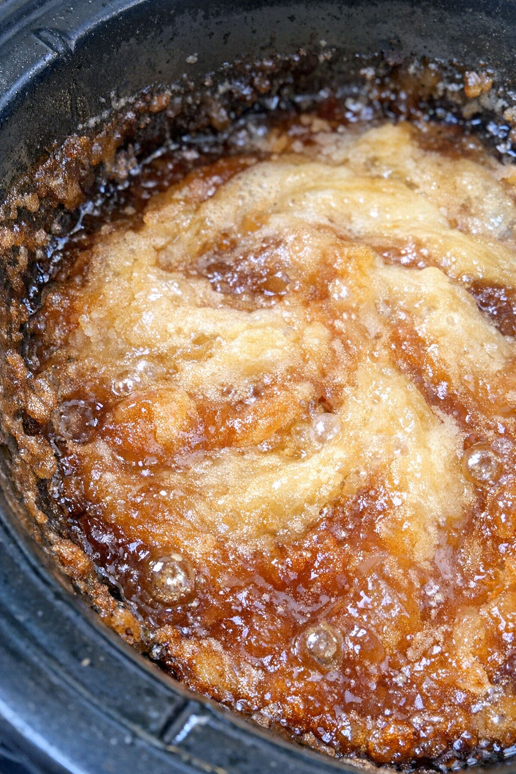 Swirling pale blonde and copper dessert in a slow cooker