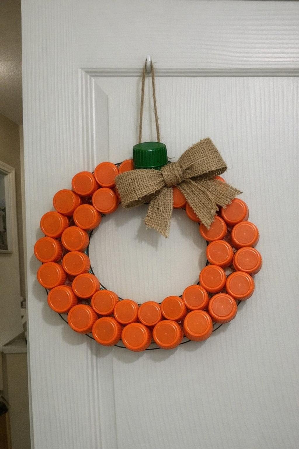 Pumpkin wreath made from orange bottle caps