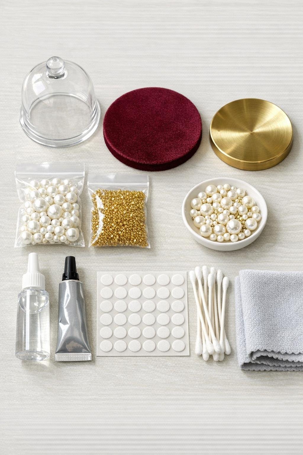 Materials for a glass cloche trinket dish laid out together