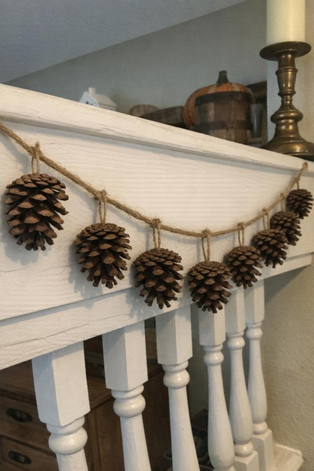 Pine cone garland draped along a mantel