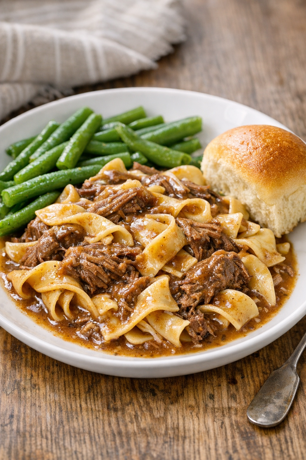 Plated beef gravy noodles with simple sides