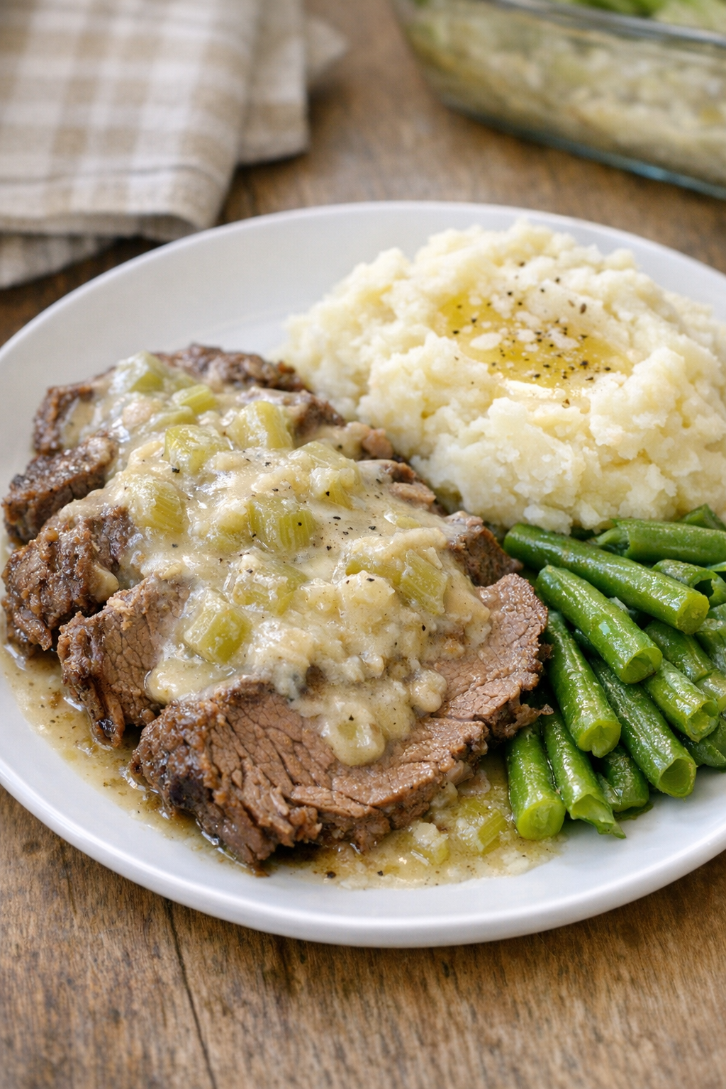 Finished Amish beef and celery bake plated with creamy sauce