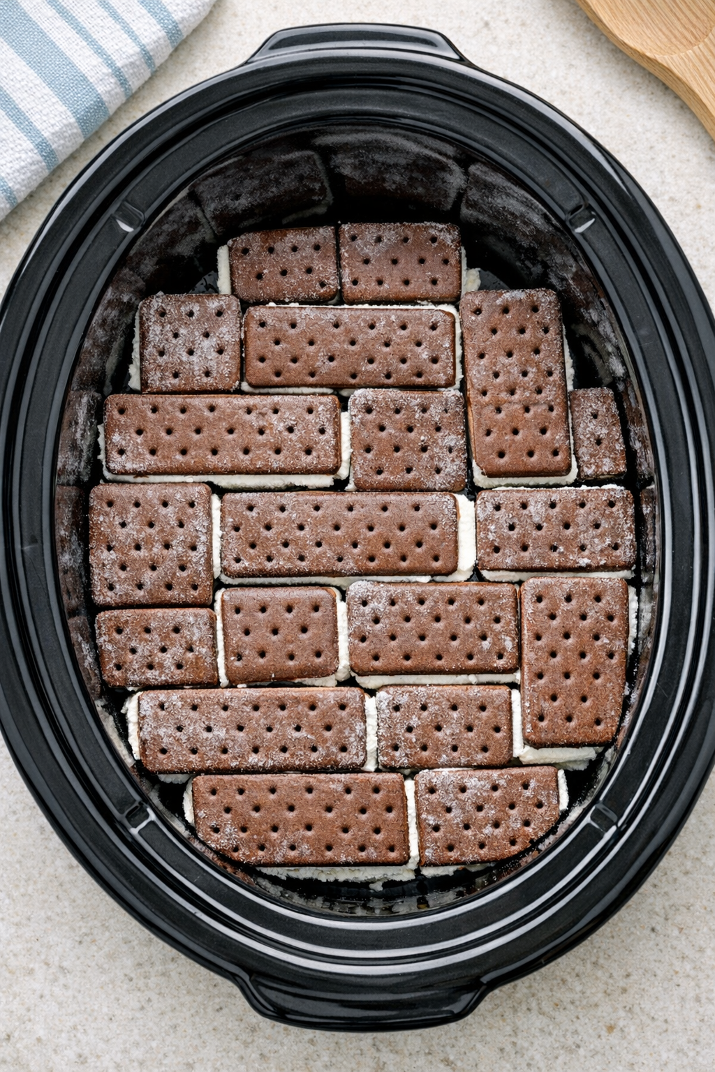 First layer of ice cream sandwiches in slow cooker