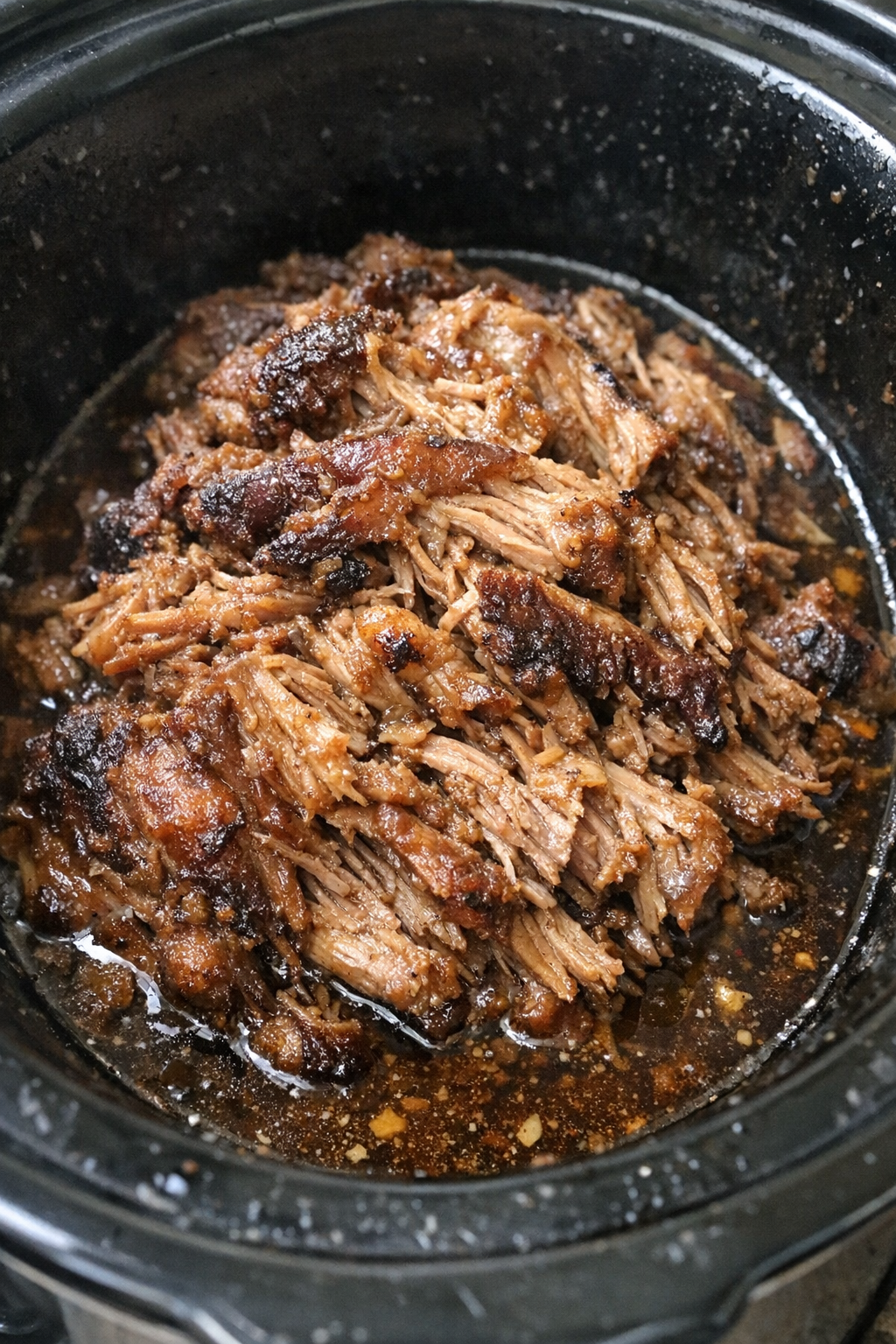 Slow cooker pork shoulder in rich juices