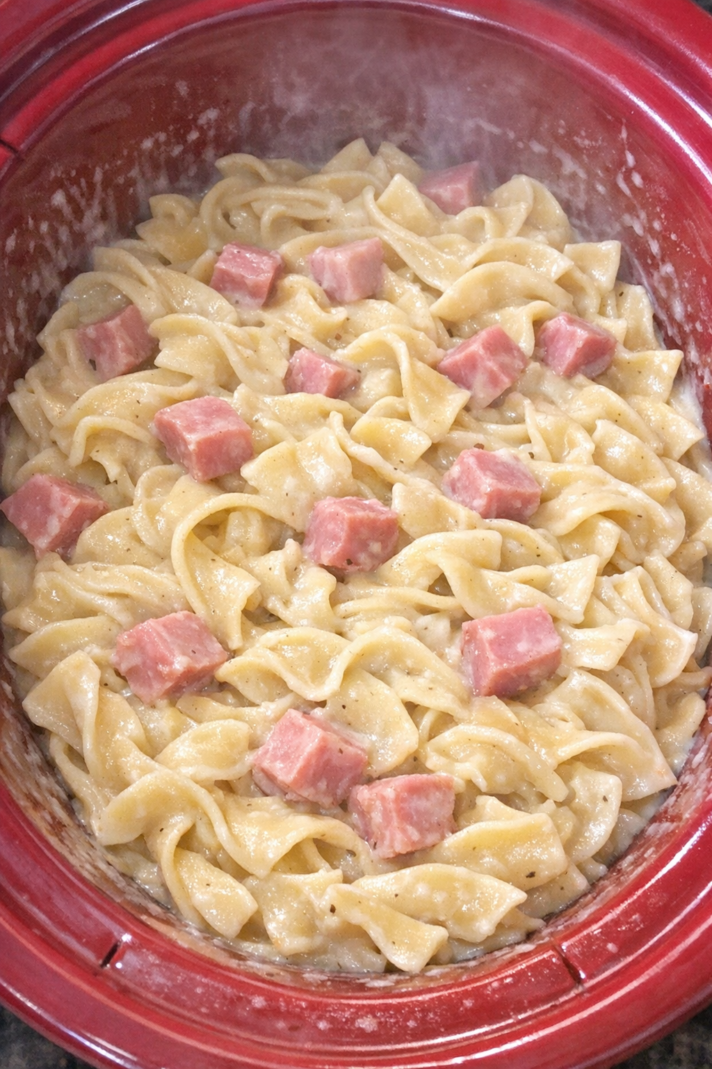 Creamy ham noodles in a red slow cooker
