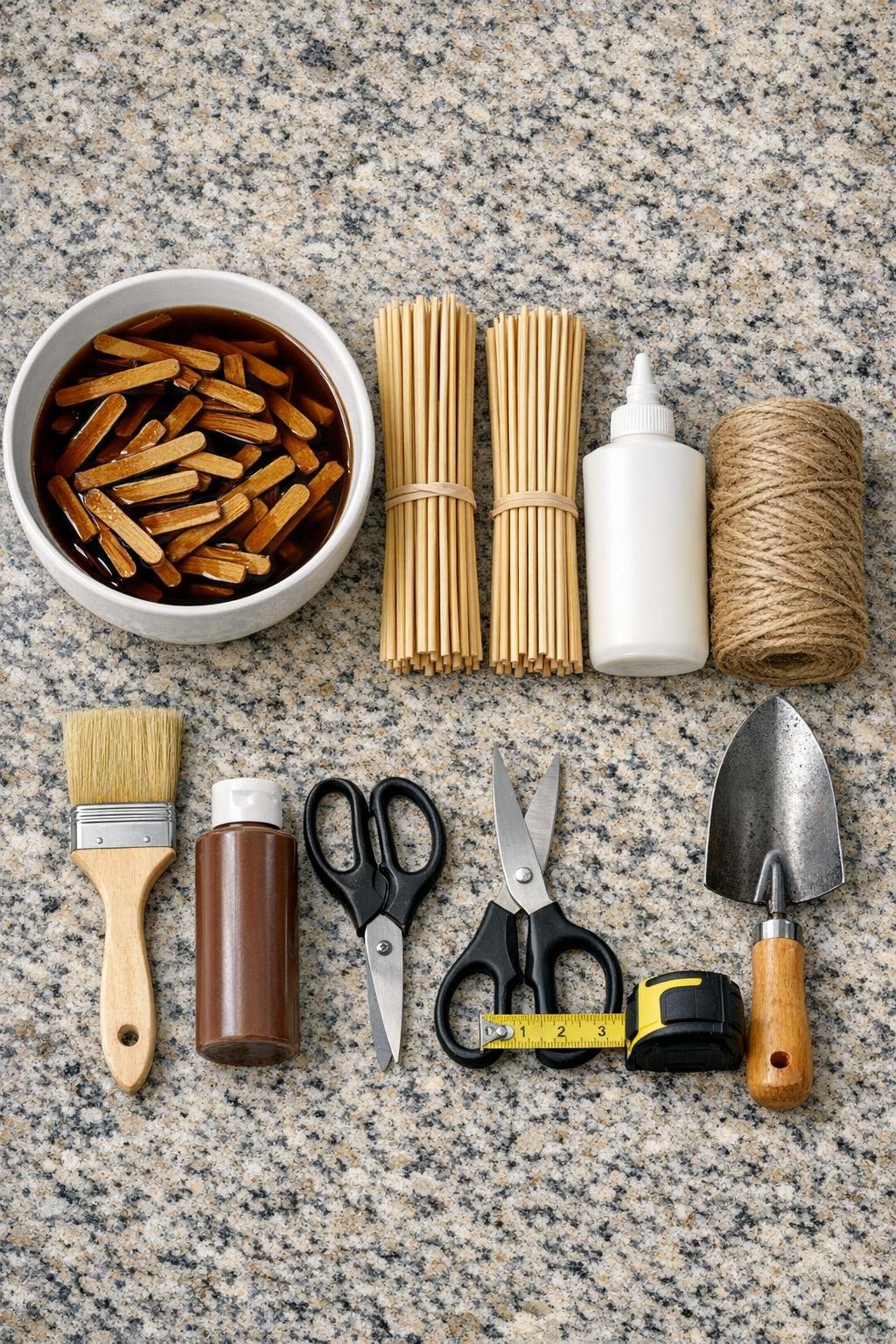 Materials for a popsicle stick garlic bed critter deterrent laid out together