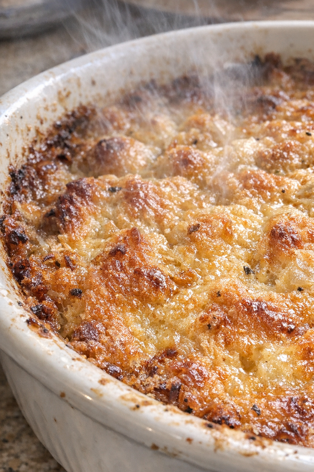 Golden crusted summer potluck bake in a ceramic dish