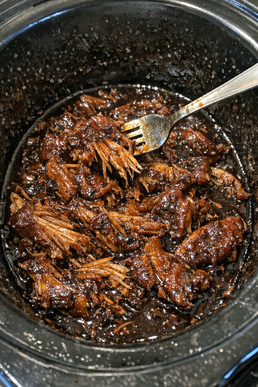 Slow cooker roasted protein in glossy dark sauce