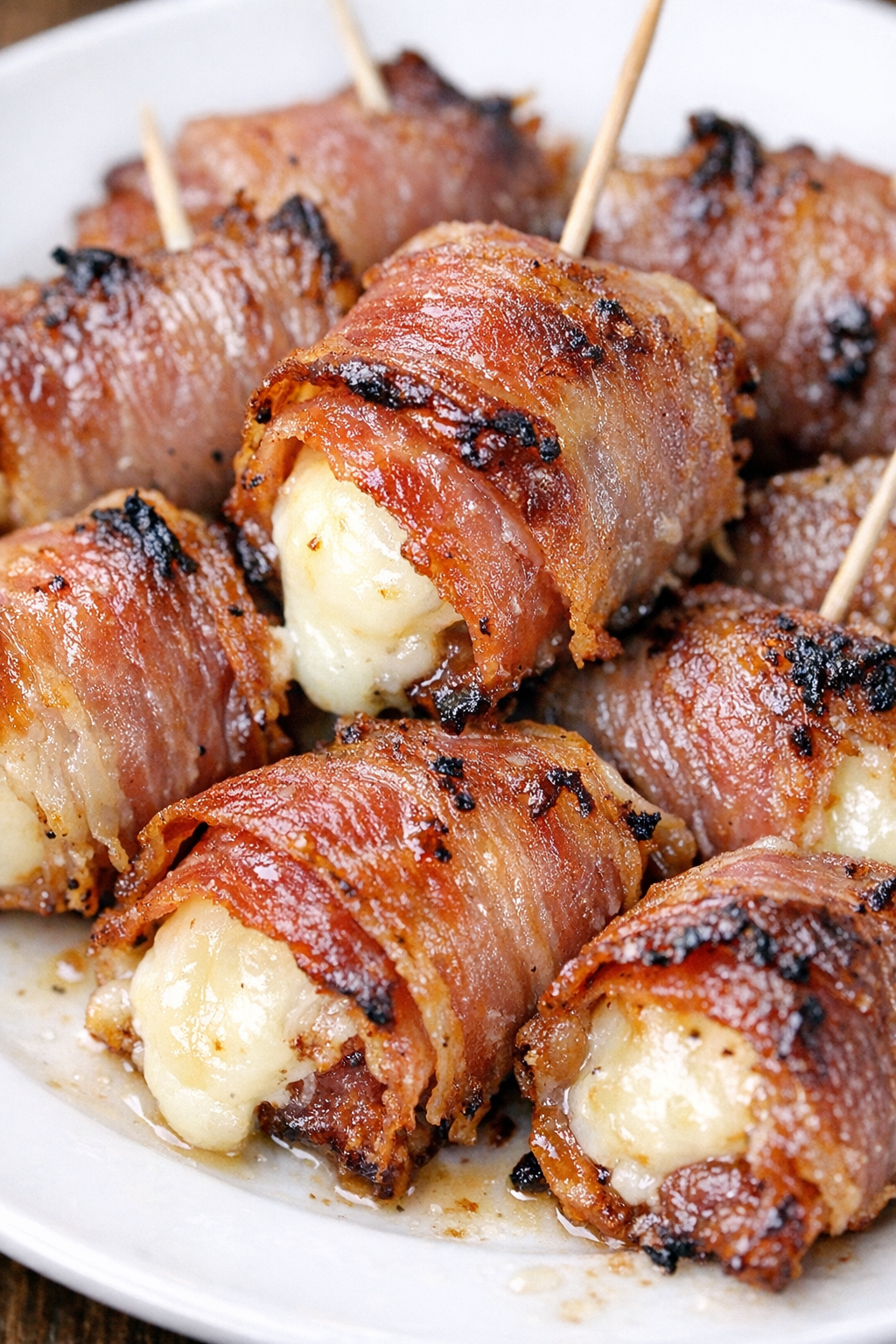 Low carb prosciutto mozzarella bites on a white plate