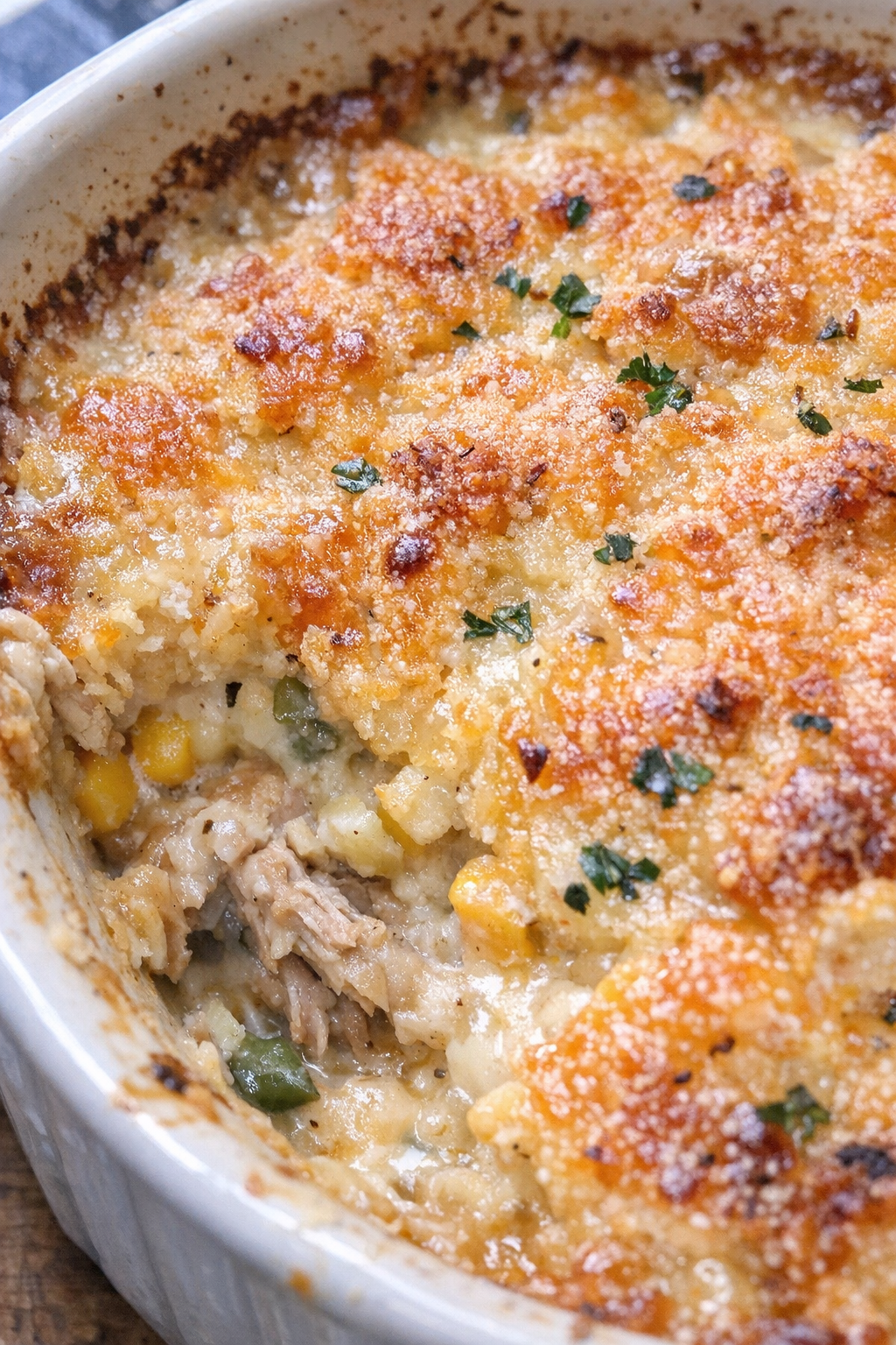Bubbling crusted casserole in a ceramic baking dish