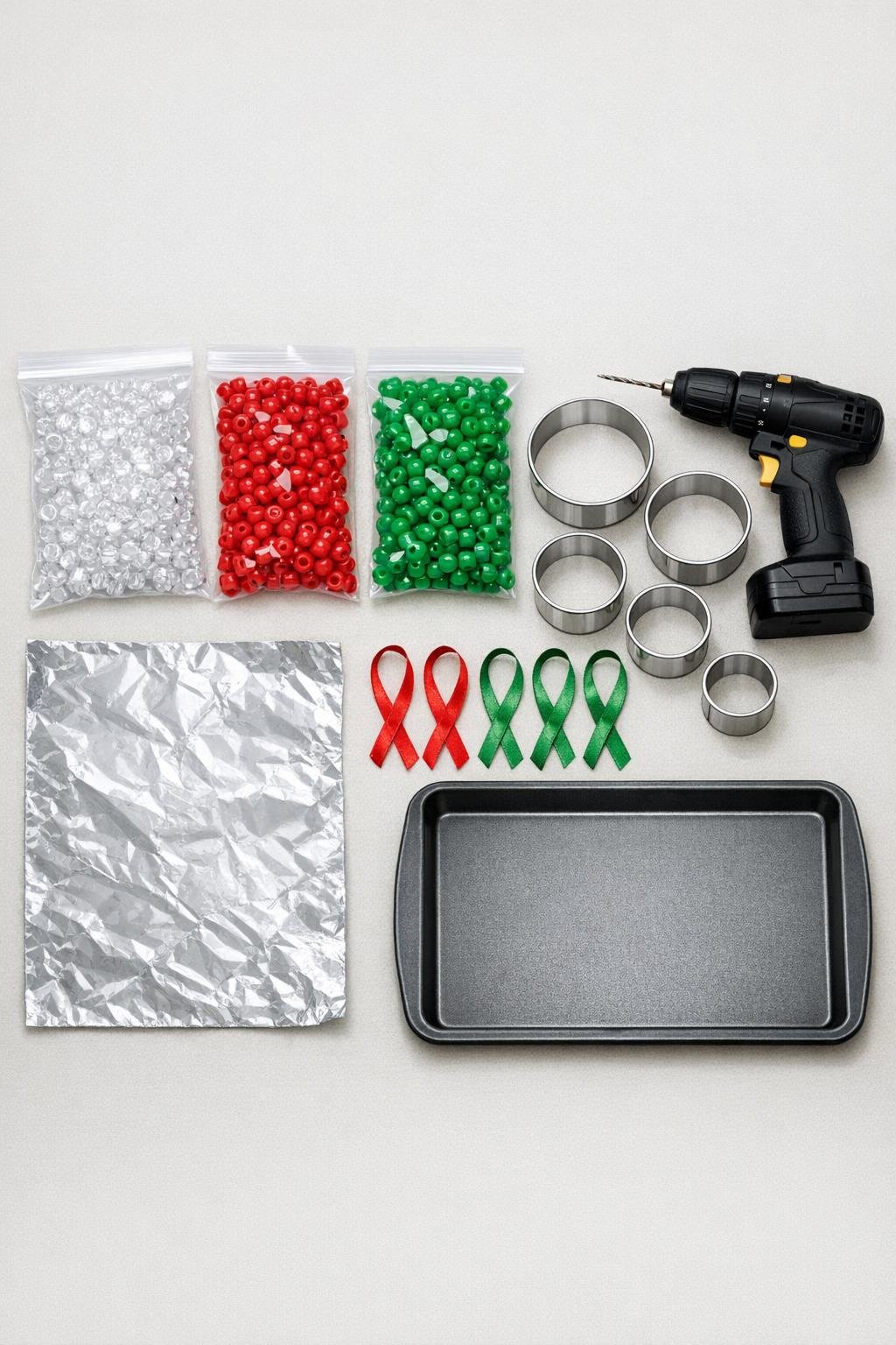 Materials for melted bead ornaments laid out on a table