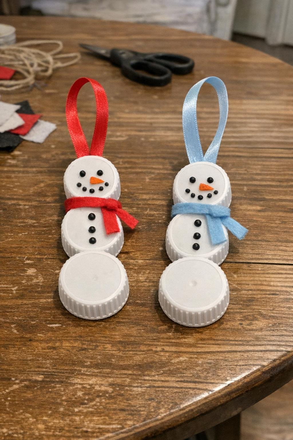 Snowman ornaments made from white bottle caps