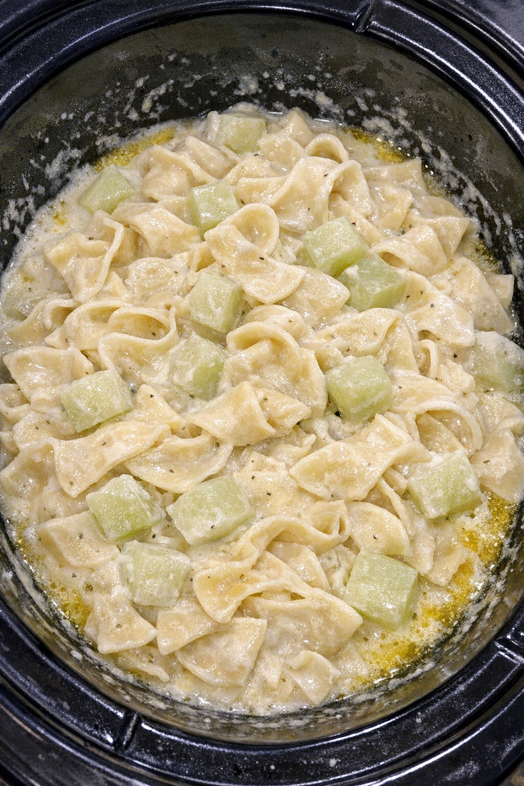 Slow cooker Amish kohlrabi cream noodles in a black slow cooker