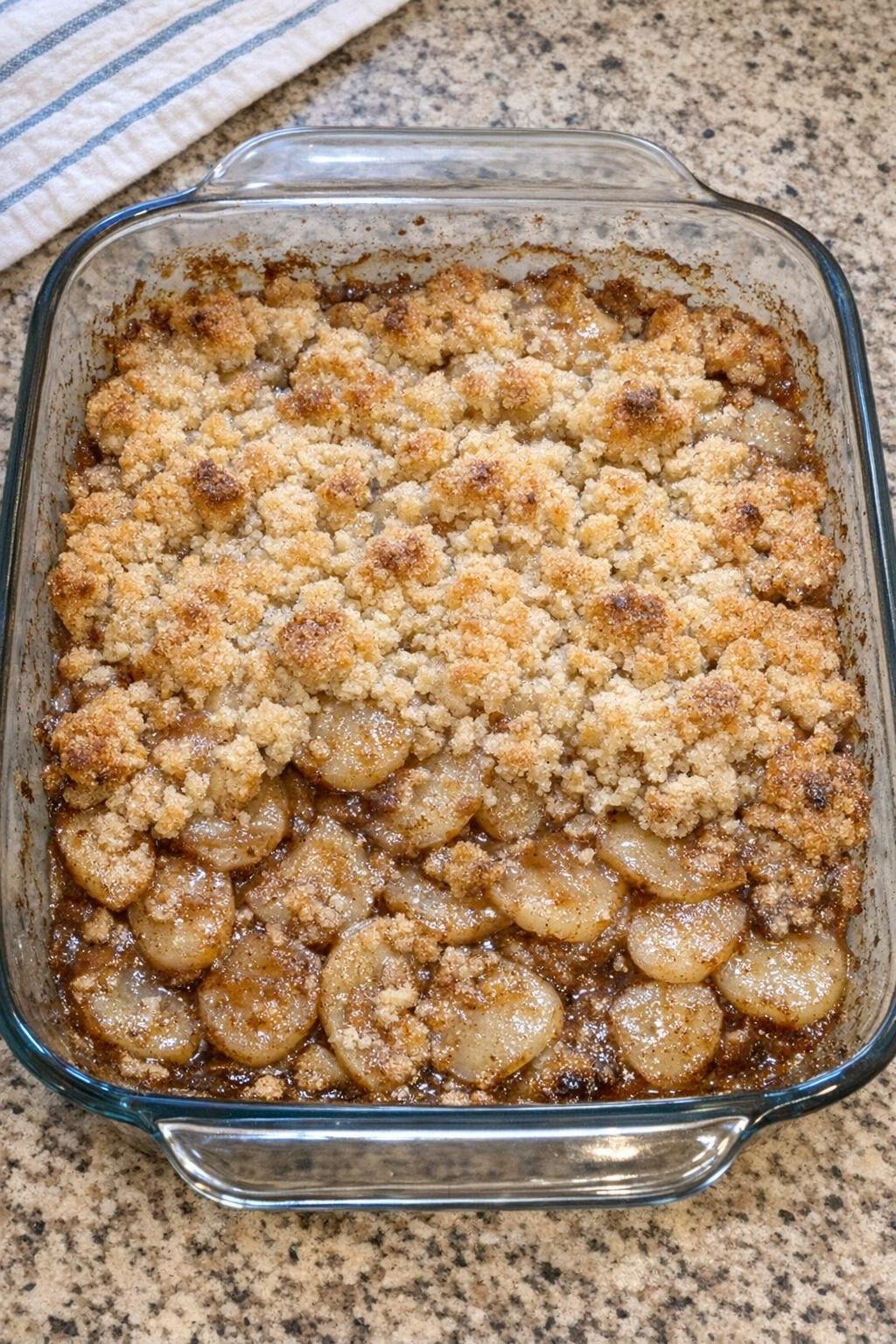 Baked mock apple dessert in a glass casserole dish