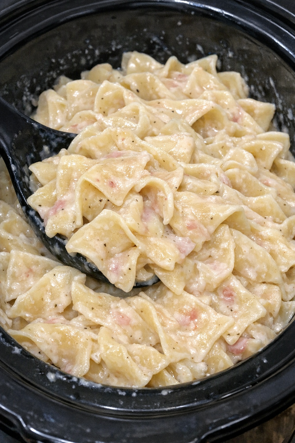 Slow cooker Amish horseradish noodles in a black slow cooker