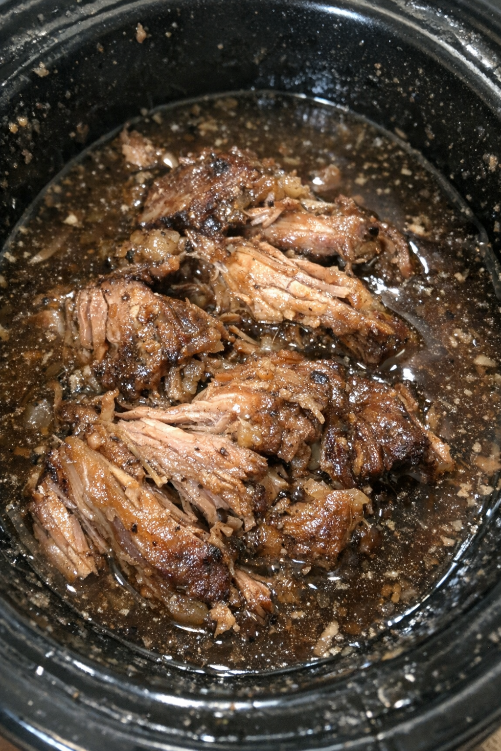 Slow-cooked pork in dark broth