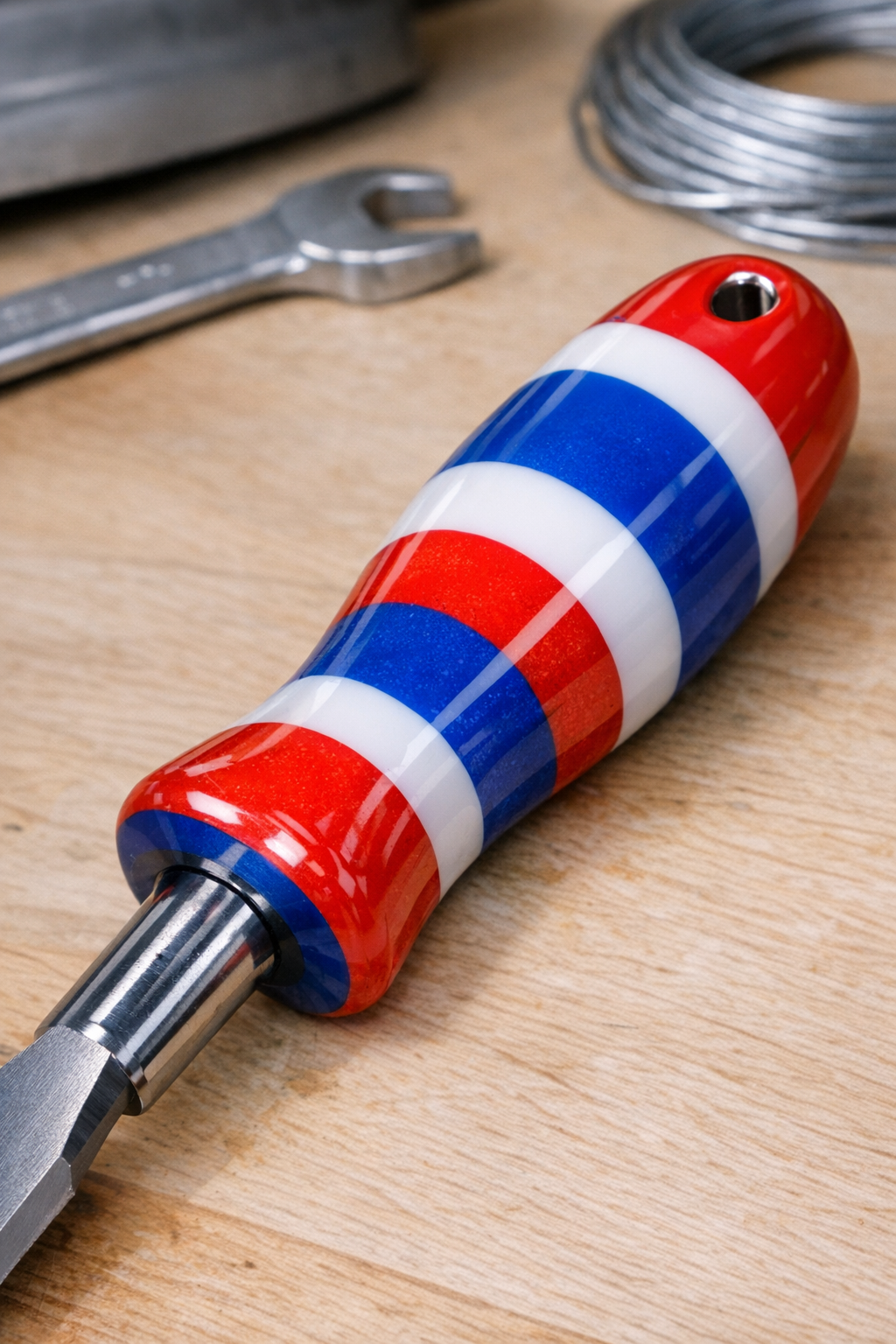 Finished hand tool with red white and blue shatterproof plastic handle