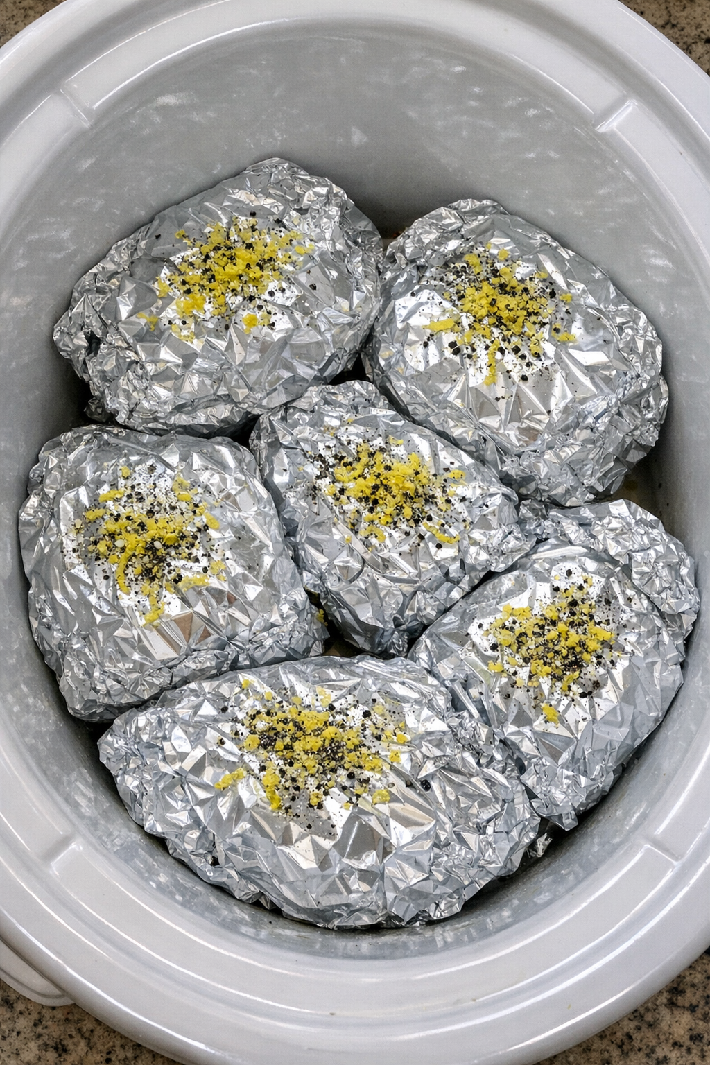 Slow cooker creamy lemon pepper pasta packets in foil